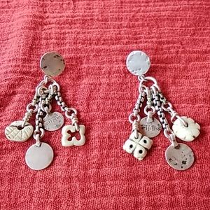 Artisan made dangling charm earrings.